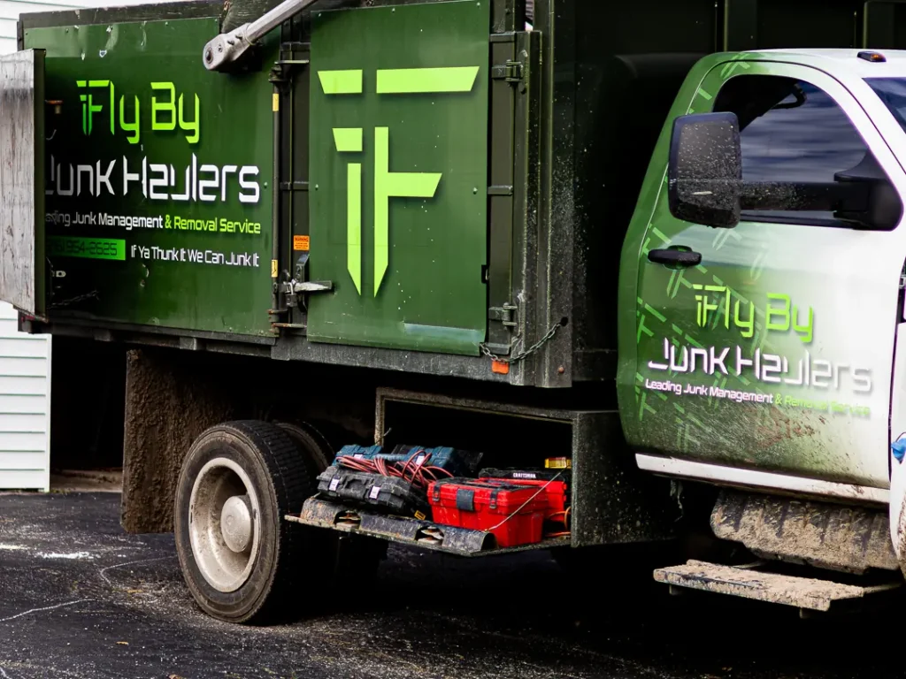 Side view of the green Fly By dump truck