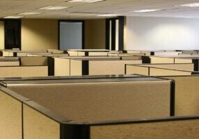 A maze of bland cubicles in an office