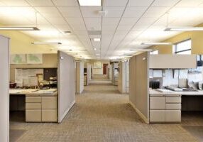 Empty hallway in modern office business building with cubicles a