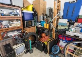 Cluttered corner full of household storage items and vintage electronics.