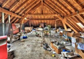 Messy attic roof space at abandoned house